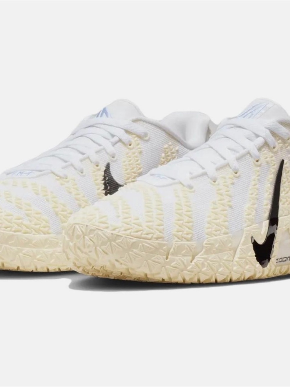 Nike White and Cream Basketball Sneaker with Black Swoosh